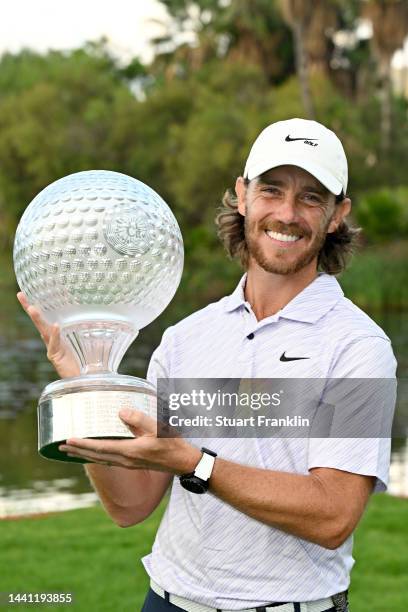 Tommy Fleetwood of England poses with the Nedbank Golf Challenge trophy after winning the Nedbank Golf Challenge on the 18th hole during Day Four of...