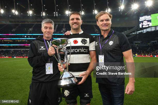 Ronan O'Gara, Coach of Barbarians, poses for a photograph with Luke Whitelock, holding the Killik Cup, and Scott Robertson, Coach of Barbarians,...