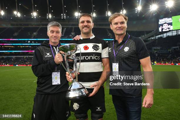 Ronan O'Gara, Coach of Barbarians, poses for a photograph with Luke Whitelock, holding the Killik Cup, and Scott Robertson, Coach of Barbarians,...