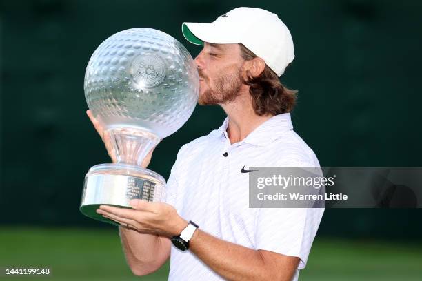 Tommy Fleetwood of England poses with the Nedbank Golf Challenge trophy after winning the Nedbank Golf Challenge on the 18th hole during Day Four of...