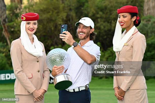 Tommy Fleetwood of England and Emirates Crew poses with the Nedbank Golf Challenge trophy after winning the Nedbank Golf Challenge on the 18th hole...