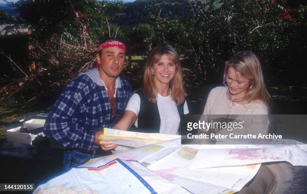 Australian actress and singer Olivia Newton-John with her husband Matt Lattanzi and cyclist Cindy Jessup at Olivia's home in May, 1994 in Byron Bay,...