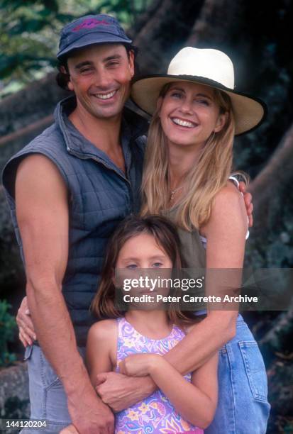 1990s: Australian actress and singer Olivia Newton-John with her husband Matt Lattanzi and their daughter Chloe in the garden of their home in the...