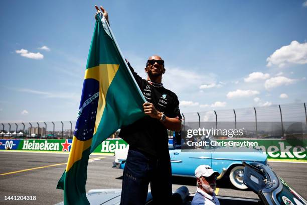 Lewis Hamilton of Great Britain and Mercedes waves to the crowd on the drivers parade prior to the F1 Grand Prix of Brazil at Autodromo Jose Carlos...