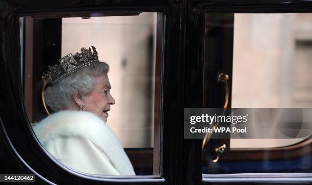 Britain's Queen Elizabeth II arrives in the Australian State Coach at the Palace of Westminster during the State Opening of Parliament on May 9, 2012...