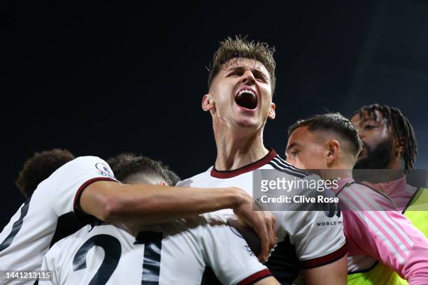 Tom Cairney of Fulham celebrates after Daniel James of Fulham scores their side's first goal during the Premier League match between Fulham FC and...