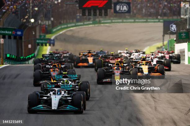 George Russell of Great Britain driving the Mercedes AMG Petronas F1 Team W13 leads the field at the start during the F1 Grand Prix of Brazil at...