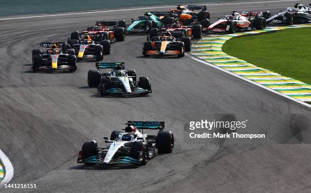 George Russell of Great Britain driving the Mercedes AMG Petronas F1 Team W13 leads the field at the start during the F1 Grand Prix of Brazil at...