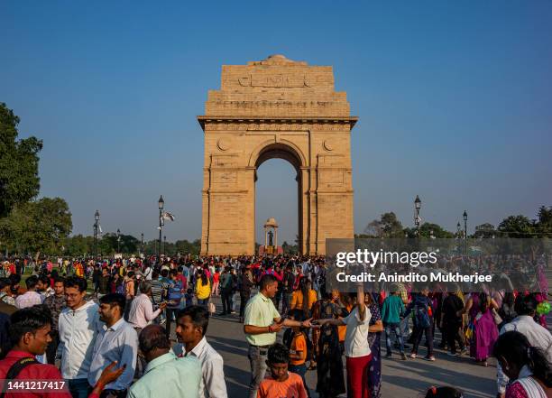 Visitors gather in huge numbers at the Indian war memorial, India Gate on November 12, 2022 in New Delhi, India. The world's population is slated to...