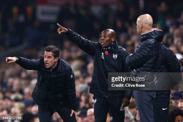 Marco Silva, Manager of Fulham, reacts with Luis Boa Morte, Coach of Fulham, during the Premier League match between Fulham FC and Manchester United...
