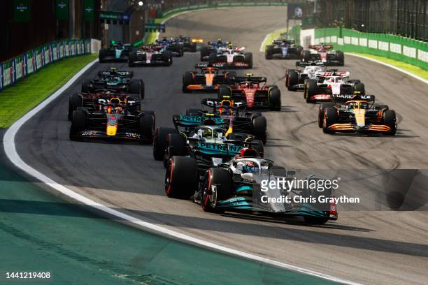 George Russell of Great Britain driving the Mercedes AMG Petronas F1 Team W13 leads the field at the start during the F1 Grand Prix of Brazil at...