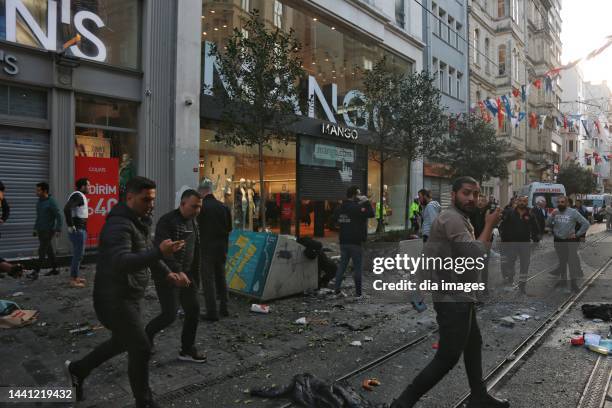 People at the scene after an explosion occurred on Istiklal street, a busy pedestrian thoroughfare on November 13, 2022 in Istanbul, Turkey. It is...