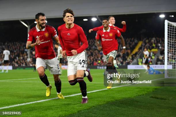 Alejandro Garnacho of Manchester United celebrates scoring their side's second goal with teammates during the Premier League match between Fulham FC...