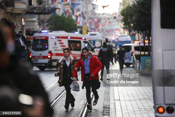 People flee the scene after an explosion occurred on Istiklal street, a busy pedestrian thoroughfare on November 13, 2022 in Istanbul, Turkey. It is...