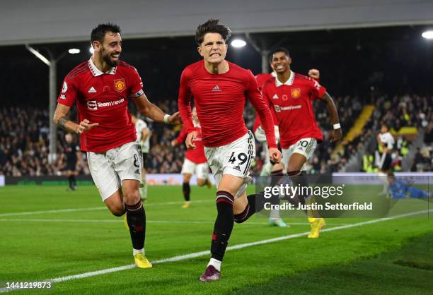 Alejandro Garnacho of Manchester United celebrates scoring their side's second goal with teammates during the Premier League match between Fulham FC...