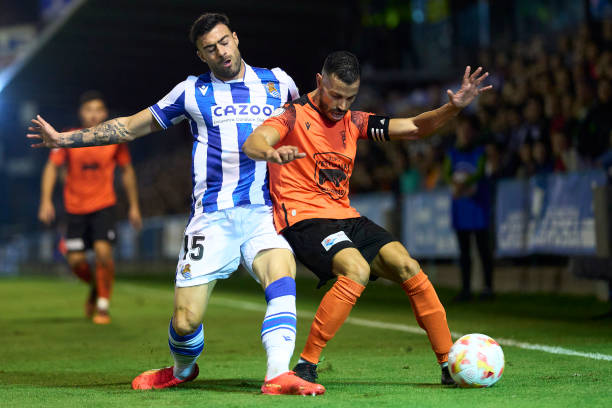Ruben Rivera of CD Cazalegas battle for the ball with Rico of Real Sociedad during the Copa del Rey first round match between CD Cazalegas and Real...