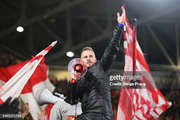 Mark Flekken of Freiburg celebrates victory with fans after the Bundesliga match between Sport-Club Freiburg and 1. FC Union Berlin at Europa-Park...
