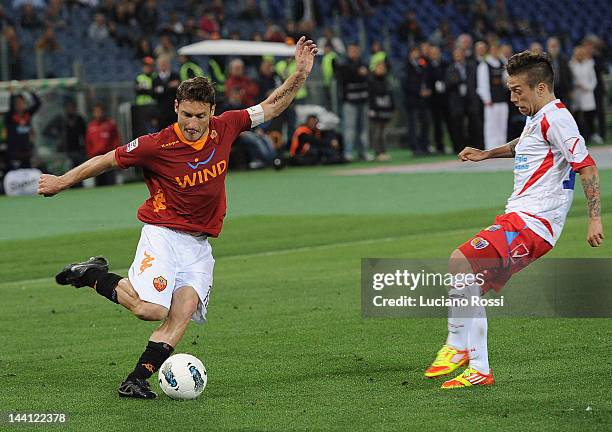 Francesco Totti of AS Roma and Alejandro Dario Gomez of Catania Calcio in action during the Serie A match between AS Roma and Catania Calcio at...