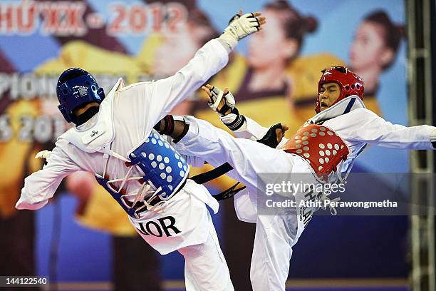 Peerathep Sila-On of Thailand in action against Anasjalal Mohammad of Jordan during day two of the 20th Asian Taekwondo Championships at Phu Tho...