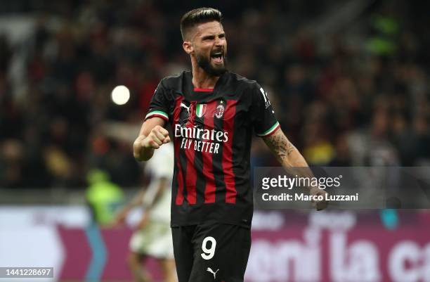 Olivier Giroud of AC Milan celebrates his team-mate's goal during the Serie A match between AC Milan and ACF Fiorentina at Stadio Giuseppe Meazza on...