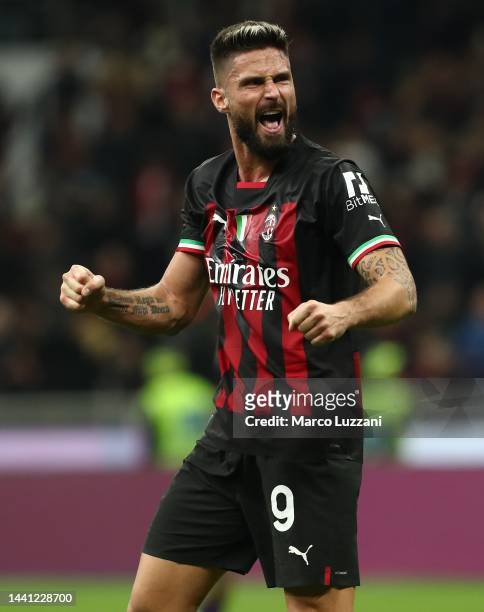 Olivier Giroud of AC Milan celebrates his team-mate's goal during the Serie A match between AC Milan and ACF Fiorentina at Stadio Giuseppe Meazza on...