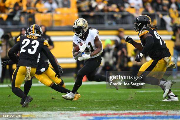 Alvin Kamara of the New Orleans Saints runs the ball during the second quarter of the game against the Pittsburgh Steelers at Acrisure Stadium on...