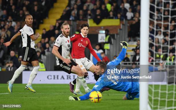 Alejandro Garnacho of Manchester United scores their side's second goal as Bernd Leno of Fulham attempts to make a save during the Premier League...