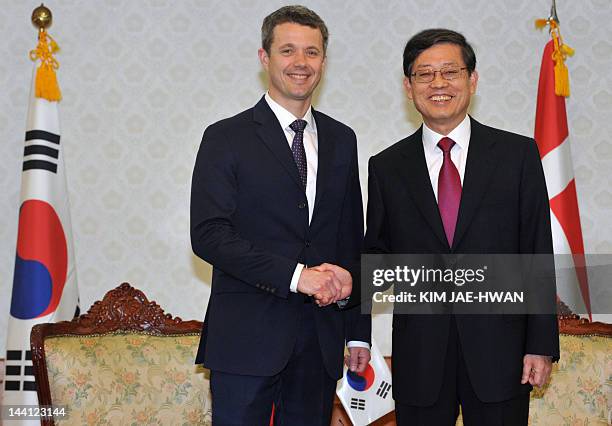 Denmark's Crown Prince Frederik shakes hands with South Korean Prime Minister Kim Hwang-Sik before a meeting in Seoul on May 10, 2012. Frederik and...