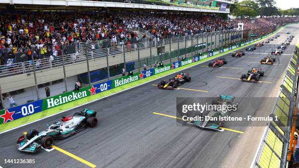 George Russell of Great Britain driving the Mercedes AMG Petronas F1 Team W13 leads the field off the line at the start during the F1 Grand Prix of...