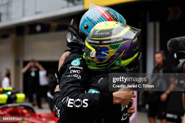 Race winner George Russell of Great Britain and Mercedes and Second placed Lewis Hamilton of Great Britain and Mercedes celebrates in parc ferme...