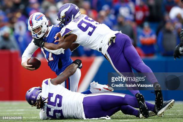 Za'Darius Smith of the Minnesota Vikings and Danielle Hunter of the Minnesota Vikings sack Josh Allen of the Buffalo Bills during the third quarter...