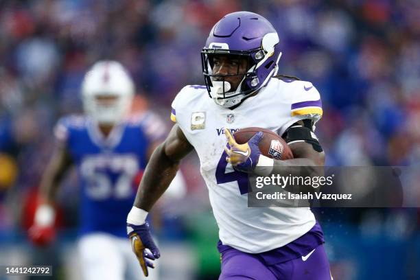 Dalvin Cook of the Minnesota Vikings runs the ball for a touchdown during the third quarter against the Buffalo Bills at Highmark Stadium on November...