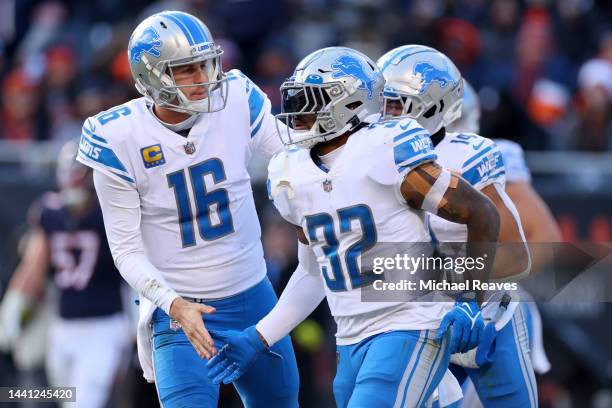 Jared Goff of the Detroit Lions celebrates with D'Andre Swift of the Detroit Lions after Swift's touchdown during the fourth quarter against the...