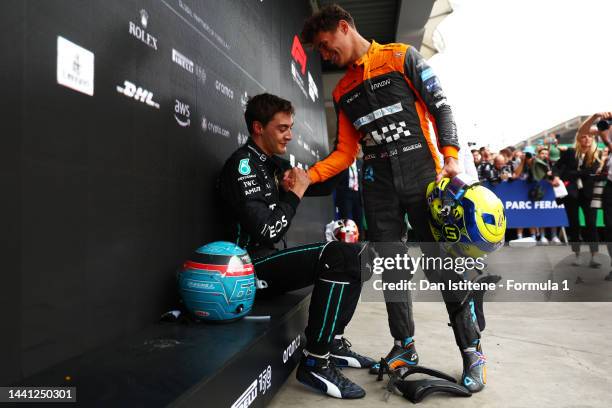 Race winner George Russell of Great Britain and Mercedes celebrates with Lando Norris of Great Britain and McLaren in parc ferme during the F1 Grand...