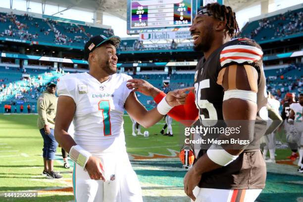 Tua Tagovailoa of the Miami Dolphins talks with Myles Garrett of the Cleveland Browns after the game at Hard Rock Stadium on November 13, 2022 in...