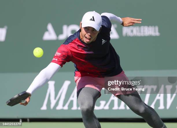 Ben Johns hits a backhand slice serve return shot against Julian Arnold in the Pro Men's Singles championship match of the 2022 Margaritaville USA...