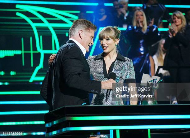 Taylor Swift accepts an award onstage from David Hasselhoff during the MTV Europe Music Awards 2022 held at PSD Bank Dome on November 13, 2022 in...