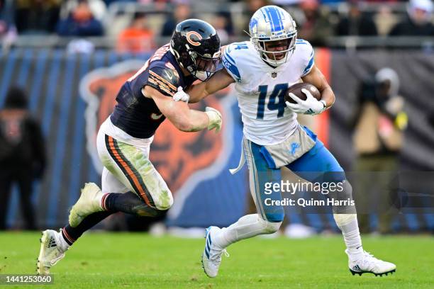 Amon-Ra St. Brown of the Detroit Lions runs for a first down against Jack Sanborn of the Chicago Bears at Soldier Field on November 13, 2022 in...