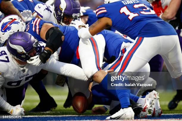 Josh Allen of the Buffalo Bills fumbles the ball on his goal line late in the fourth quarter against the Minnesota Vikings at Highmark Stadium on...