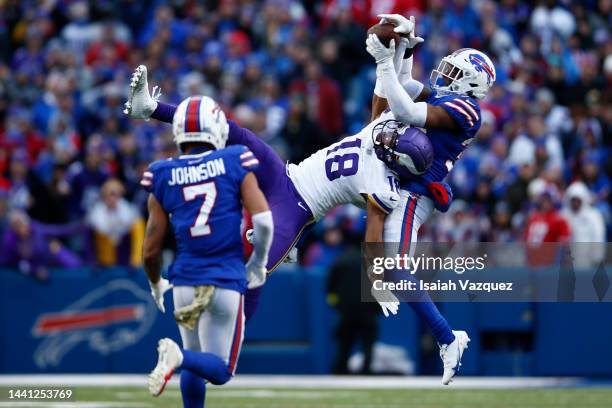 Justin Jefferson of the Minnesota Vikings catches a pass in front of Cam Lewis of the Buffalo Bills during the fourth quarter at Highmark Stadium on...