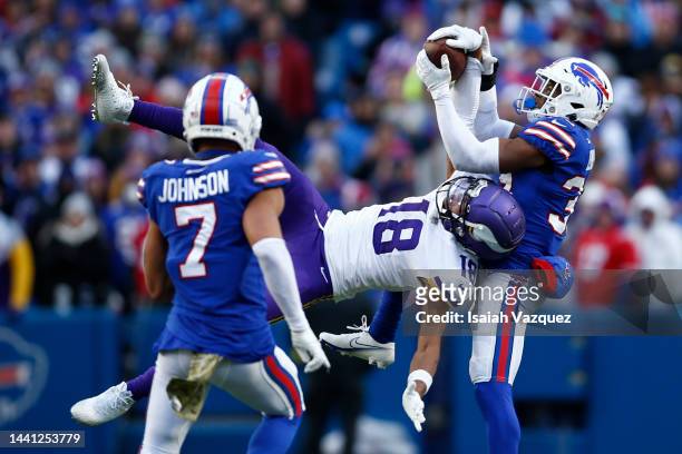 Justin Jefferson of the Minnesota Vikings catches a pass in front of Cam Lewis of the Buffalo Bills during the fourth quarter at Highmark Stadium on...