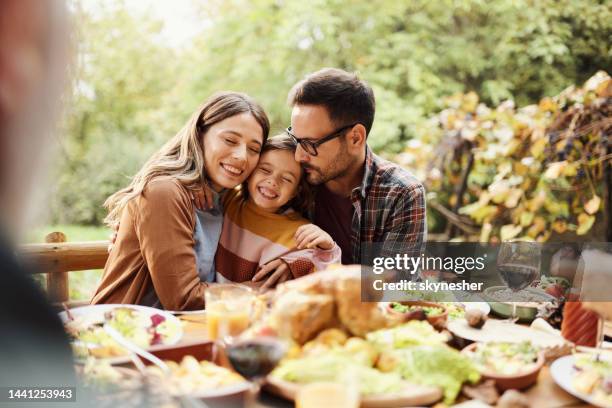 loving family enjoying in lunch outdoors. - family lunch stock pictures, royalty-free photos & images