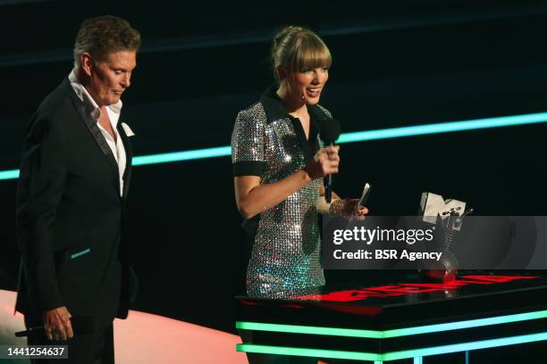 Taylor Swift accepts the "Best Artist" award from David Hasselhoff during the 2022 MTV Europe Music Awards at the ISS Dome on November 13, 2022 in...