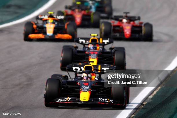 Max Verstappen of the Netherlands driving the Oracle Red Bull Racing RB18 leads a line of cars during the F1 Grand Prix of Brazil at Autodromo Jose...