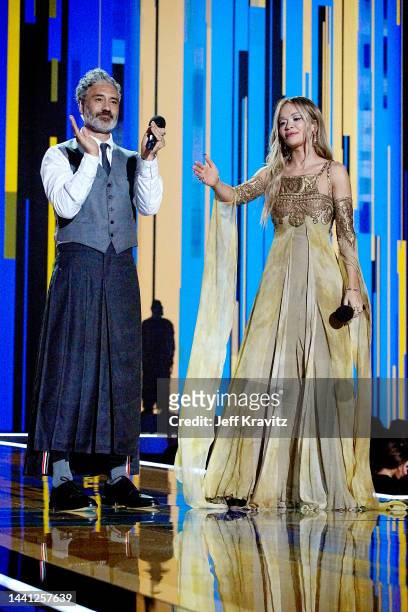 Taika Waititi and Rita Ora speak onstage during the MTV Europe Music Awards 2022 held at PSD Bank Dome on November 13, 2022 in Duesseldorf, Germany.