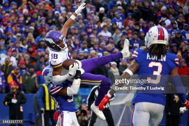 Justin Jefferson of the Minnesota Vikings catches a pass in front of Cam Lewis of the Buffalo Bills during the fourth quarter at Highmark Stadium on...