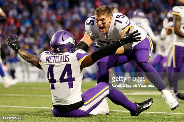 Brian O'Neill of the Minnesota Vikings celebrates with Josh Metellus of the Minnesota Vikings after their 33-30 overtime win against the Buffalo...