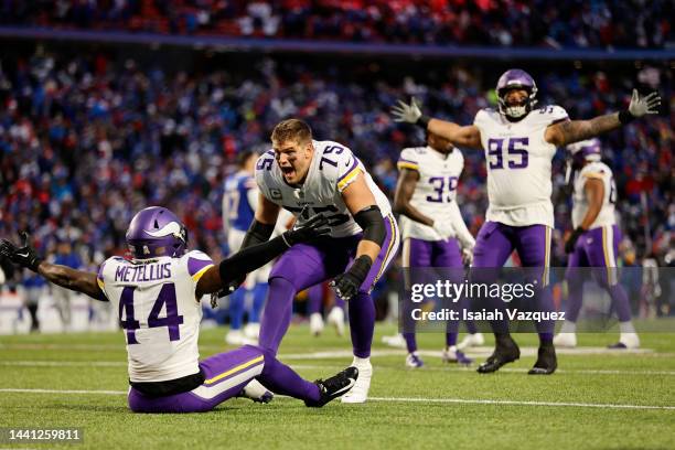 Brian O'Neill of the Minnesota Vikings celebrates with Josh Metellus of the Minnesota Vikings after their 33-30 overtime win against the Buffalo...