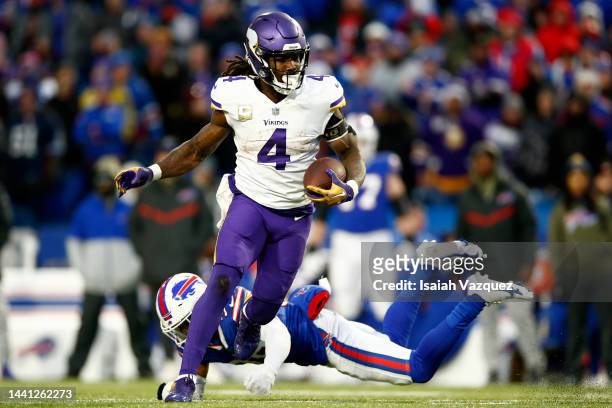 Dalvin Cook of the Minnesota Vikings runs the ball during the second half against the Buffalo Bills at Highmark Stadium on November 13, 2022 in...