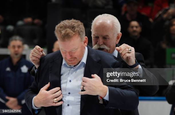 Daniel Alfredsson receives his Hockey Hall of Fame jacket prior from Lanny Macdonald to the HHoF Legends Classic game at the Scotiabank Arena on...